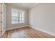 Bright room with large window and hardwood flooring perfect for use as an office at 1721 Birdhaven Ln, Wendell, NC 27591