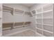 A spacious walk-in closet with shelves and rods provides ample storage space at 1721 Birdhaven Ln, Wendell, NC 27591