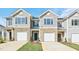 Charming townhomes feature stone accents and private garage entries at 1909 Frost Dr, Haw River, NC 27258