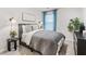 Cozy bedroom featuring neutral tones, a comfortable quilt, and ample natural light at 1910 Frost Dr, Haw River, NC 27258