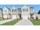 Charming townhomes featuring durable siding, stone accents, and attached garages, perfect for comfortable and stylish living at 1910 Frost Dr, Haw River, NC 27258