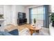 Cozy living room with modern decor, large windows, and a seamless flow into the kitchen and dining areas at 1910 Frost Dr, Haw River, NC 27258