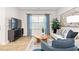 Comfortable living room with stylish furnishings, large windows, and a cozy atmosphere for relaxation and entertainment at 1910 Frost Dr, Haw River, NC 27258