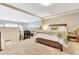 Comfortable bedroom with a wooden bed frame and a view of the living area at 200 S Dawson St # 103, Raleigh, NC 27601