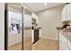 Kitchen area featuring stainless steel refrigerator and microwave above the range at 200 S Dawson St # 103, Raleigh, NC 27601
