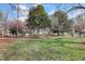 Lush green park setting with a mix of mature trees, open grassy areas, and walking paths for relaxation and recreation at 200 S Dawson St # 103, Raleigh, NC 27601