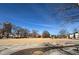 Open town square featuring a grass field, bare trees, and seating, under a clear blue sky at 200 S Dawson St # 103, Raleigh, NC 27601