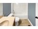 Bathroom featuring a shower and tub combo, single vanity, and neutral color palette at 2042 Compacta Dr, Wendell, NC 27591
