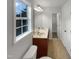 Bright bathroom with a double sink vanity, natural light and neutral color palette at 2042 Compacta Dr, Wendell, NC 27591