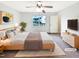 Comfortable bedroom featuring a ceiling fan, large window, and neutral decor at 2042 Compacta Dr, Wendell, NC 27591