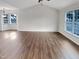 Bright living room featuring hardwood floors, vaulted ceilings, and large windows at 2042 Compacta Dr, Wendell, NC 27591