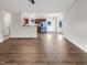Spacious open living room with hardwood floors and view into the kitchen at 2042 Compacta Dr, Wendell, NC 27591