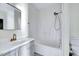 Bathroom showcasing a vanity sink with gray cabinets and a shower-tub combination at 210 Monk Rd, Durham, NC 27704