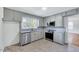 Charming kitchen featuring modern appliances, stylish cabinets, and marble countertops at 210 Monk Rd, Durham, NC 27704