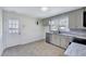 Charming kitchen featuring modern appliances, stylish cabinets, and marble countertops at 210 Monk Rd, Durham, NC 27704
