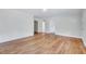 Bright living room with natural light, pristine walls, and gleaming hardwood flooring at 210 Monk Rd, Durham, NC 27704