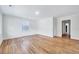 Spacious living room featuring pristine walls and gleaming hardwood flooring at 210 Monk Rd, Durham, NC 27704