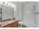 Bathroom features a tub, granite countertop, wood vanity, and neutral decor at 232 Eyam Hall Ln, Apex, NC 27502