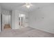Open bedroom with a hallway view to other rooms at 232 Eyam Hall Ln, Apex, NC 27502