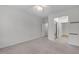 Open bedroom with a hallway view to other rooms and carpeted floors at 232 Eyam Hall Ln, Apex, NC 27502