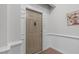 Neutral-colored front door, showcasing the unit number and classic hardware at 232 Eyam Hall Ln, Apex, NC 27502