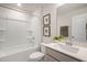 Clean bathroom featuring a shower and bathtub combination and framed artwork at 26 Kitty Branch Way, Smithfield, NC 27577