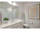Well-lit bathroom features modern fixtures, a spacious counter, and a framed art piece at 26 Kitty Branch Way, Smithfield, NC 27577