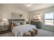 Bedroom featuring stylish decor, including a plush bed, neutral color palette, and decorative accents at 26 Kitty Branch Way, Smithfield, NC 27577
