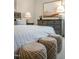 Cozy bedroom featuring a plush bed, decorative pillows, and woven ottomans; perfect for relaxation at 26 Kitty Branch Way, Smithfield, NC 27577