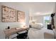 Well-appointed bedroom with a study nook, comfortable bed, and bright natural light at 26 Kitty Branch Way, Smithfield, NC 27577