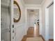 Elegant hallway featuring wood floors and an ornate circular mirror at 26 Kitty Branch Way, Smithfield, NC 27577