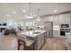Open-concept kitchen with island and stainless steel appliances at 26 Kitty Branch Way, Smithfield, NC 27577