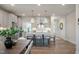 Modern kitchen with stainless appliances, island with seating, and pendant lighting at 26 Kitty Branch Way, Smithfield, NC 27577
