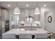 This kitchen features pendant lighting, an island with seating, and stainless steel appliances at 26 Kitty Branch Way, Smithfield, NC 27577