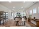 Open-concept living and dining area with hardwood floors, fireplace, and lots of natural light at 26 Kitty Branch Way, Smithfield, NC 27577