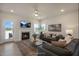 Cozy living room featuring a fireplace, plush sofas, and abundant natural light at 26 Kitty Branch Way, Smithfield, NC 27577
