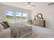 Spacious main bedroom with large windows and a decorative wood dresser at 26 Kitty Branch Way, Smithfield, NC 27577