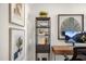 Modern office decor with a clock, desk accessories, and decorative wall art at 26 Kitty Branch Way, Smithfield, NC 27577