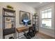 Stylish office space with a modern desk setup, shelving, and natural light at 26 Kitty Branch Way, Smithfield, NC 27577