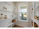 Well-organized pantry with ample shelving and a window for natural light at 26 Kitty Branch Way, Smithfield, NC 27577