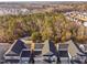 An aerial view shows the neighborhood homes near a wooded area at 2612 Nordmann Fir Rd, Raleigh, NC 27616