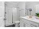 Bathroom featuring a glass enclosed shower, vanity, toilet, and neutral colored paint at 2612 Nordmann Fir Rd, Raleigh, NC 27616