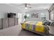Main bedroom features modern furniture, tray ceiling and large windows at 2612 Nordmann Fir Rd, Raleigh, NC 27616