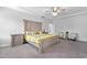 Spacious bedroom boasts large bed, neutral tones, tray ceiling and ceiling fan at 2612 Nordmann Fir Rd, Raleigh, NC 27616