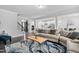 Open-concept living area featuring a comfortable sectional sofa, stylish rug, and seamless flow to the kitchen at 2612 Nordmann Fir Rd, Raleigh, NC 27616