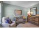 Cozy Bedroom with a glider, crib and soothing color palette at 273 Hawksmoore Ln, Lillington, NC 27546