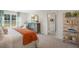 Inviting main bedroom with a neatly made bed, decorative wall mirror and an adjacent view into the ensuite bathroom at 273 Hawksmoore Ln, Lillington, NC 27546