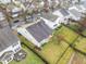 An aerial view showcases the backyard with a patio, landscaping, and fencing at 2815 Mebane Ln, Durham, NC 27703