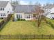 Aerial view of a fenced backyard with green lawn and mature trees at 2815 Mebane Ln, Durham, NC 27703