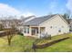 Backyard features a well-maintained lawn, patio, and black metal fencing at 2815 Mebane Ln, Durham, NC 27703